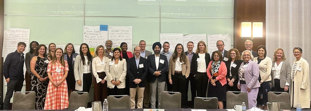 Group of participants in conference room.