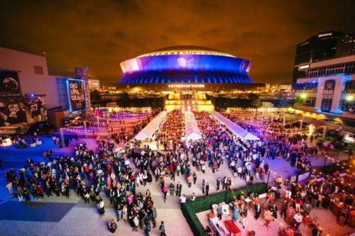 an aerial shot of a crowd outside of a venue ACS GenNow Network Impact Image