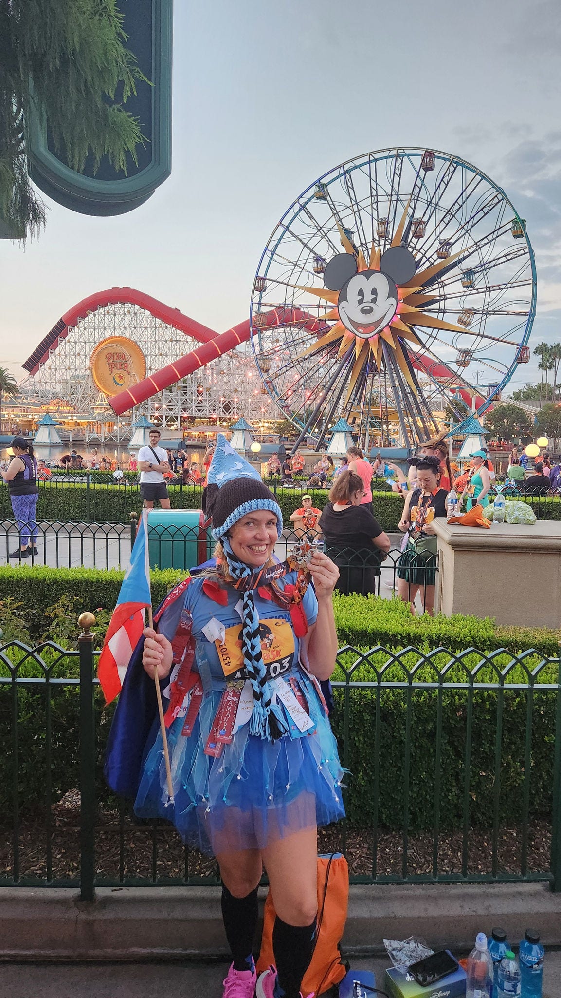 person in front of ferris wheel