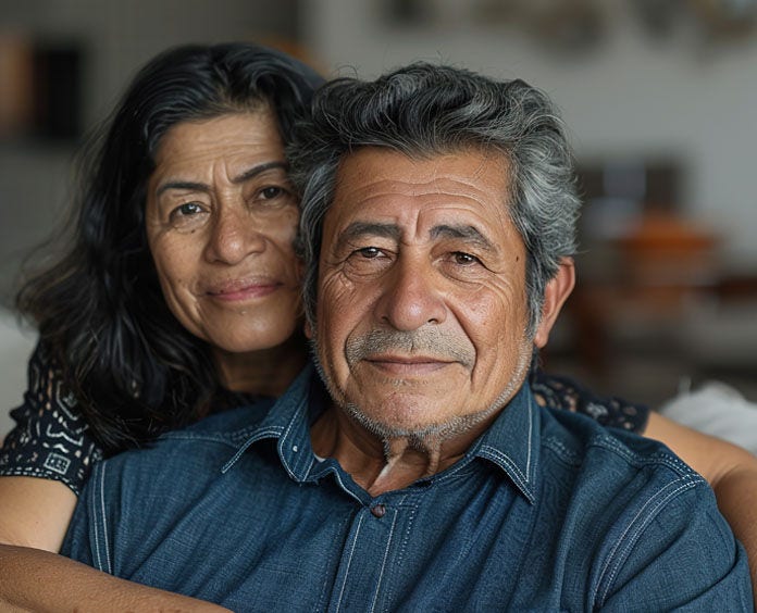 A hispanic woman wraps her arms around her husband