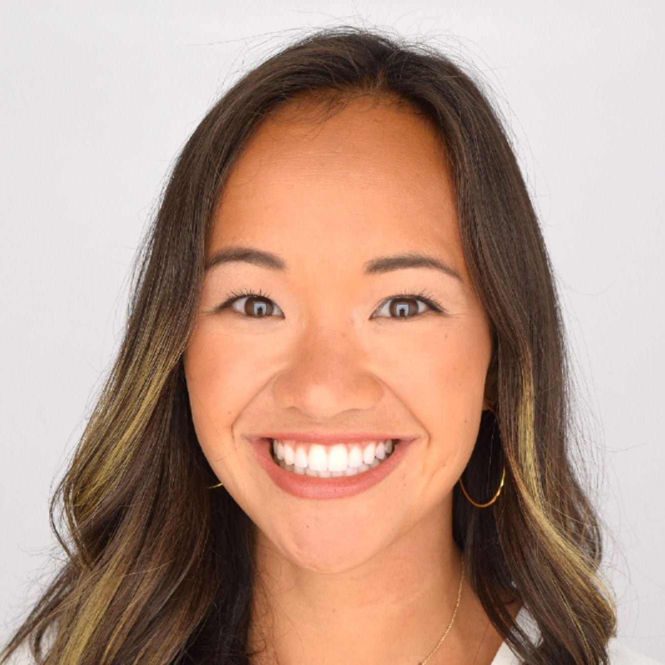 Headshot of post-doctoral fellow Kathryn Chiang, PhD, MPH, in a white blouse and gold earrings