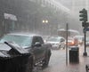 Traffic in a downtown area during a storm