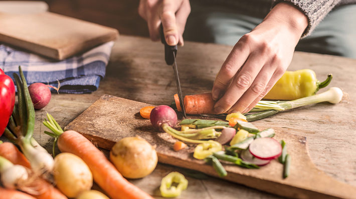 Hands Slice Carrots Cutting Board